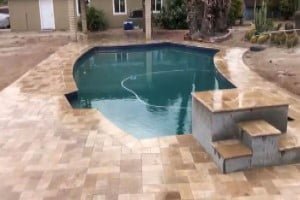 gold travertine pool deck